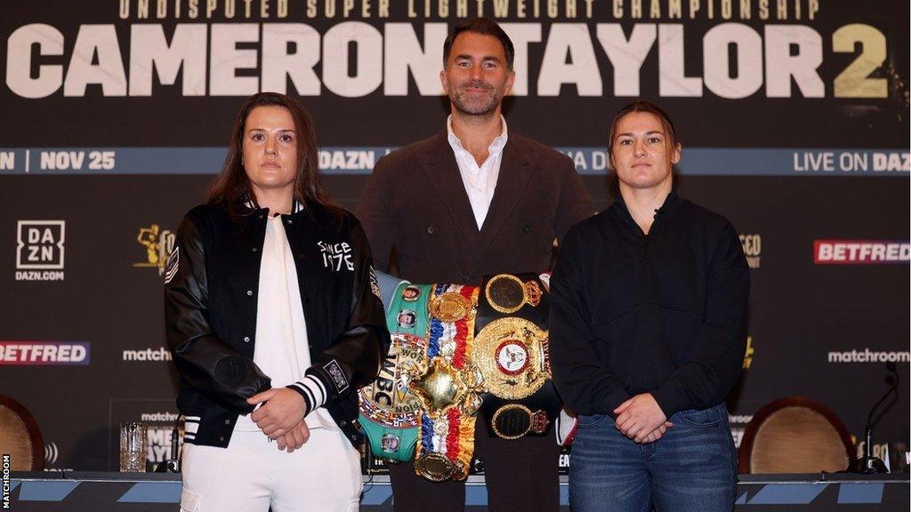 Chantelle Cameron and Katie Taylor pose for pictures with Eddie Hearn holding world titles behind them