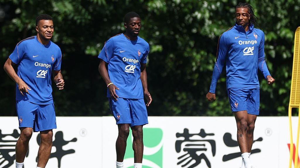 Kylian Mbappe, Ousmane Dembele and Michael Olise take part in a training session