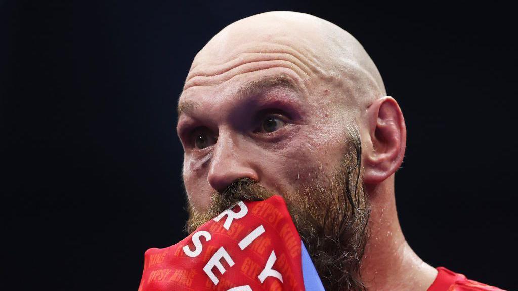 Tyson Fury looks dejected in the ring