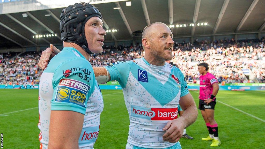 James Roby and Jonny Lomax share a moment as St Helens beat Wigan at St James' Park