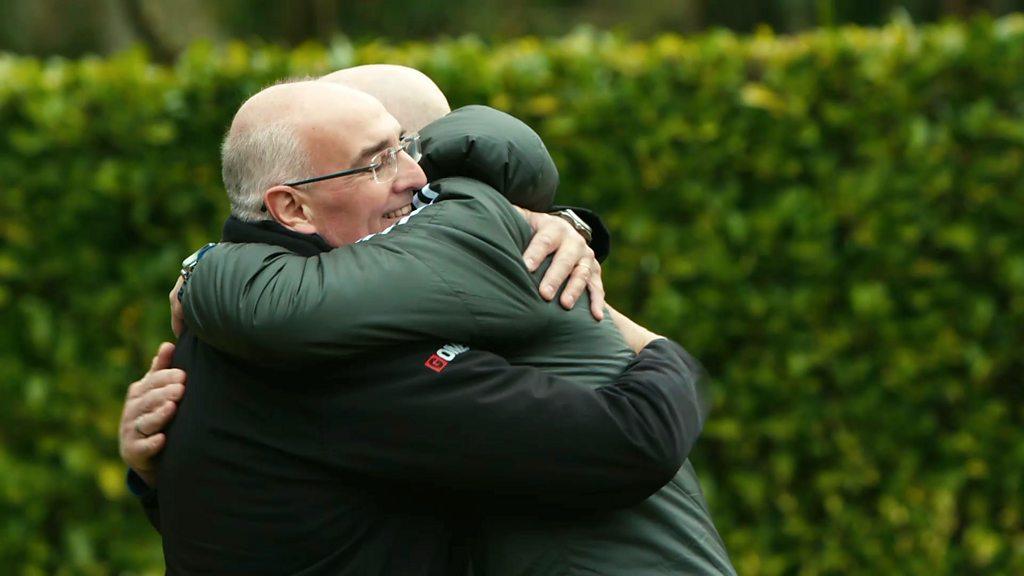 Andy and David hug each other