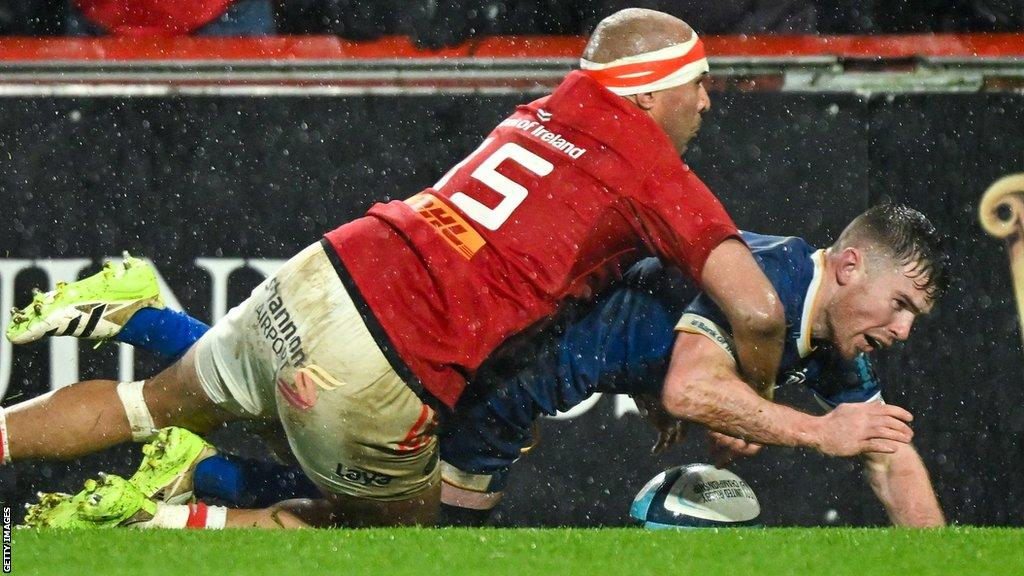 Munster's Simon Zebo produces a try-saving tackle on Leinster's Luke McGrath in the first half