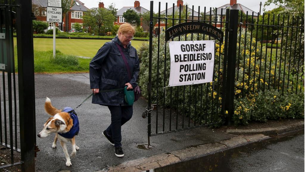 Voter leaves a polling station in Cardiff