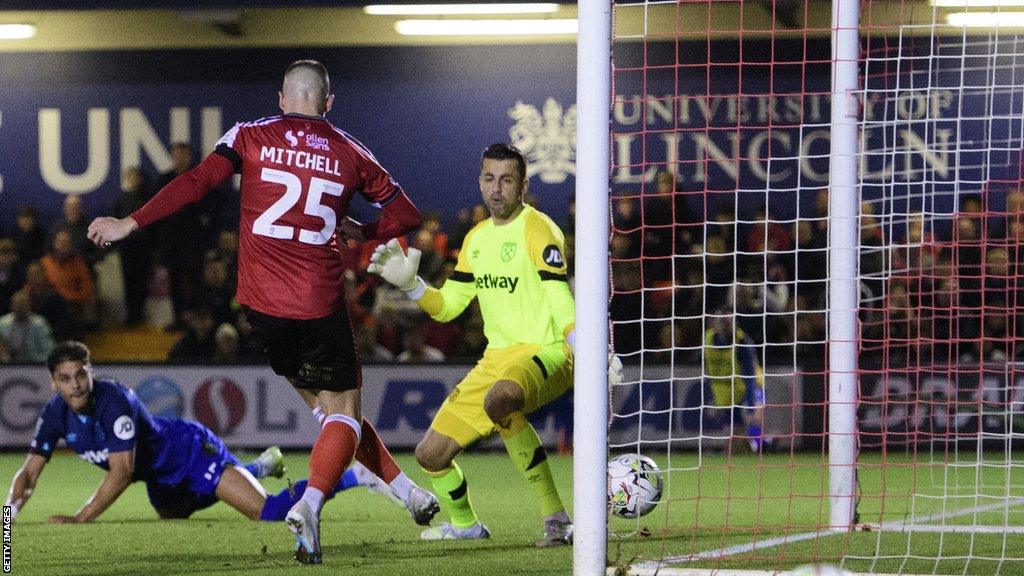 Lincoln City's Alex Mitchell has a goal ruled out for offside against West Ham