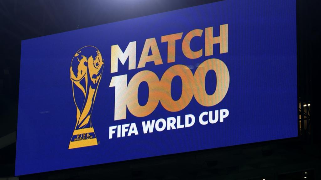 A graphic on the screen in the stadium marking the 1000th game at the Fifa World Cup