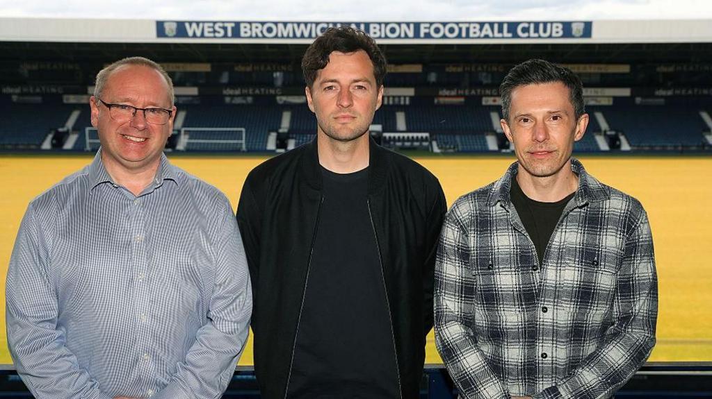 Mark Miles stands on the left with former head coach Ryan Mason and ex-sporting director and president Andrew Nestor on the right in the stands at The Hawthorns.