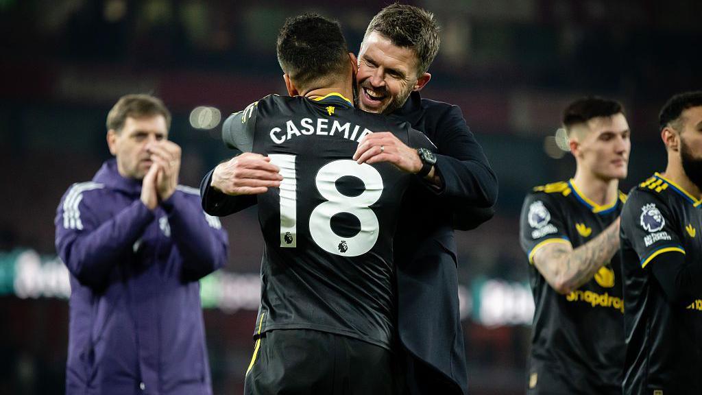 Casemiro hugs Manchester United interim manager Michael Carrick