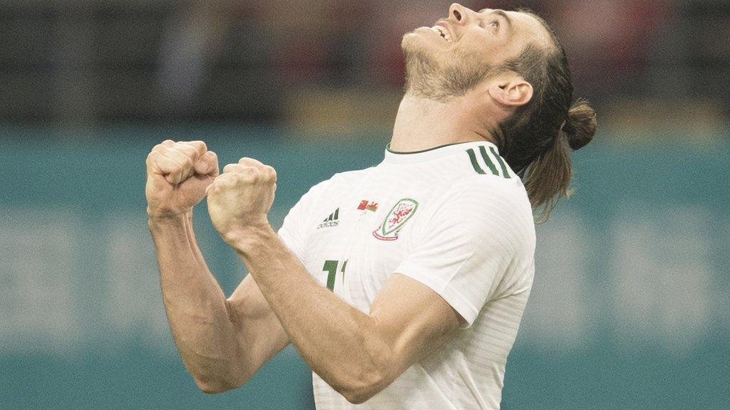 Gareth Bale looks up to the skies in celebration