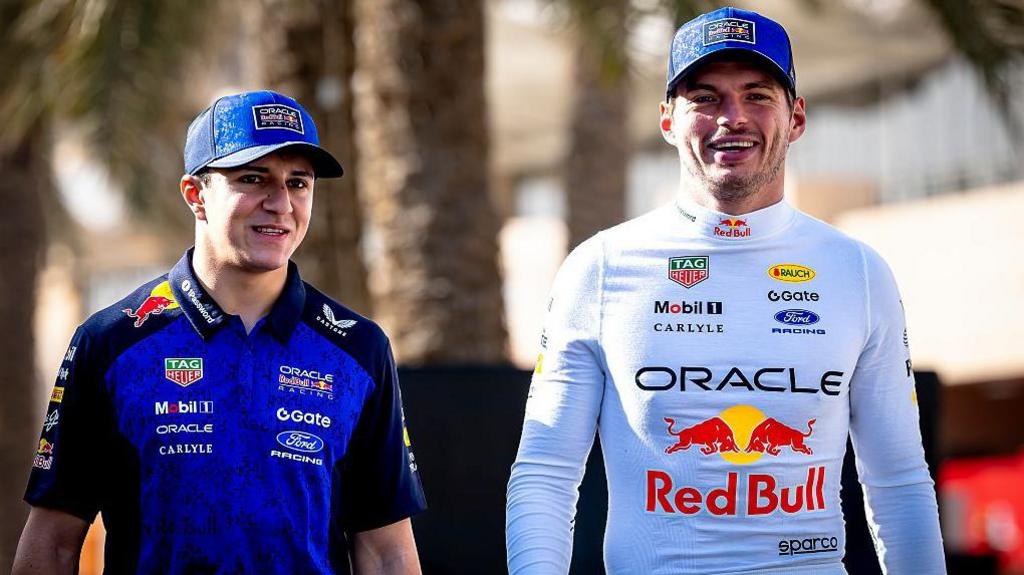 Isack Hadjar walks in the Bahrain paddock with new team-mate Max Verstappen