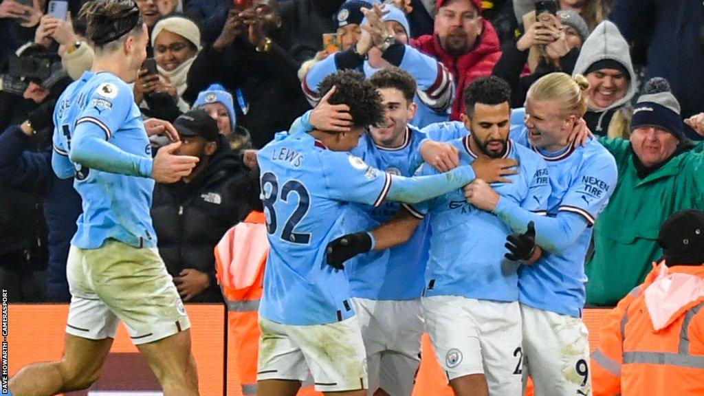 Manchester City players celebrate a goal