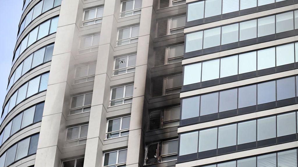 Smoke can be seen coming out of a building after dozens of people were evacuated from a 50-story skyscraper that caught fire at Puerto Madero in Buenos Aires on 11 February 2025.