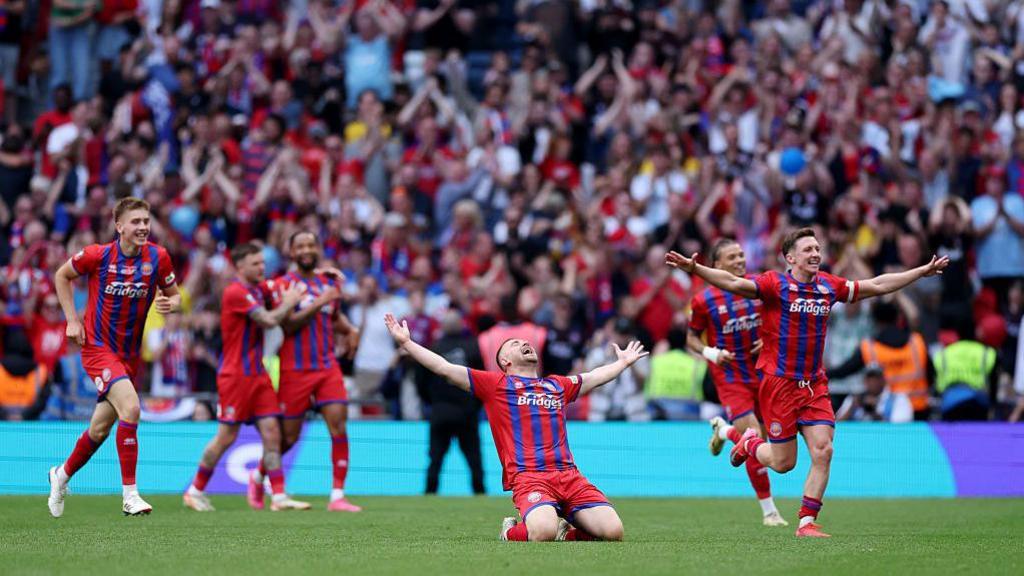 Josh Barrett celebrates scoring his side's third goal at Wembley