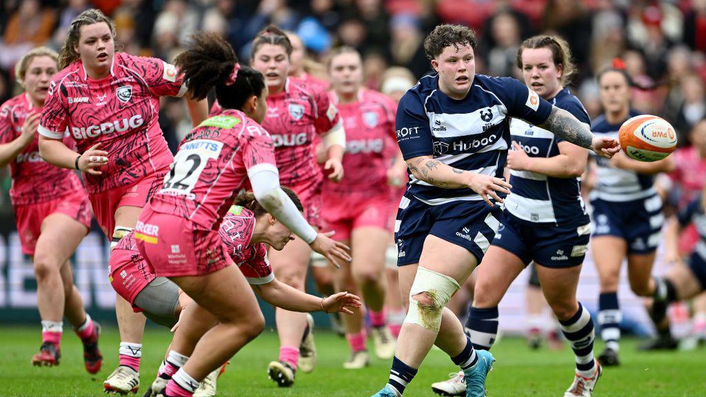 Hannah Botterman (right) throws the ball during Bristol Bear's match with Gloucester-Hartpury