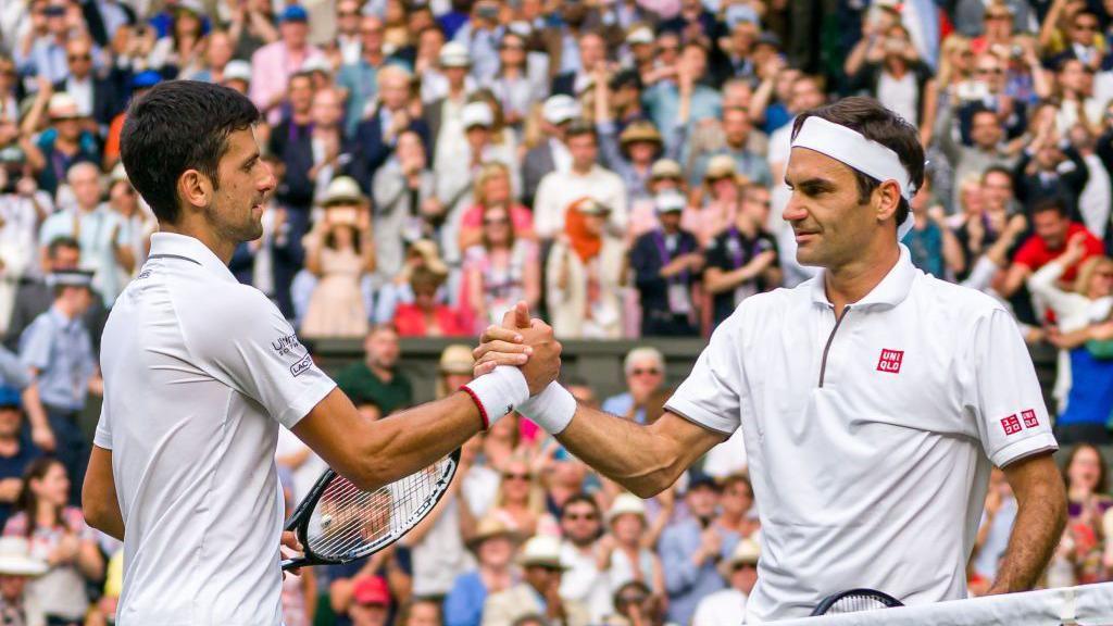 Novak Djokovic and Roger Federer shake hands