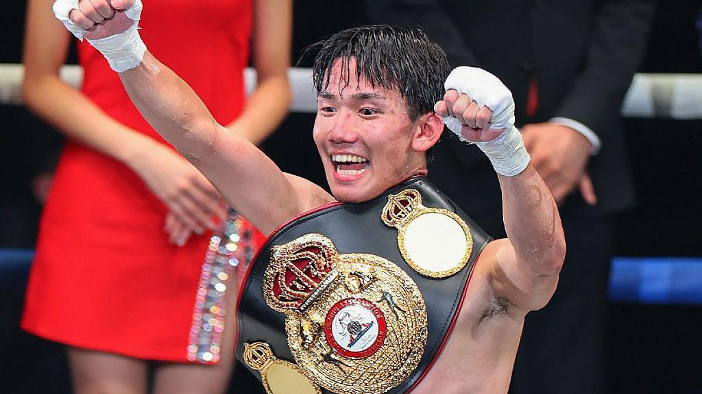 Kyosuke Takami celebrates with the WBA title
