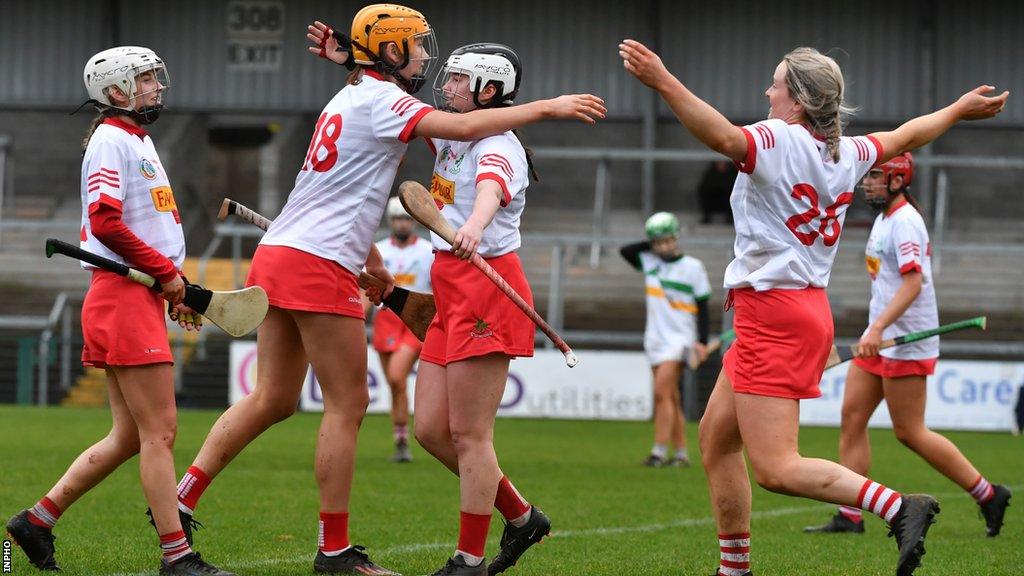 Loughgiel players celebrate after the final whistle at the Athletic Grounds