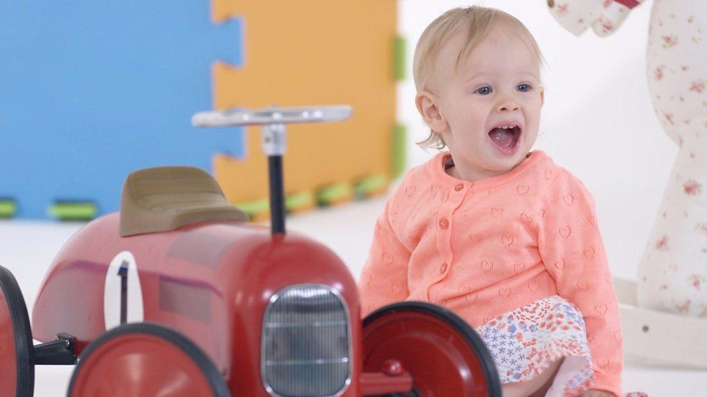 Baby with toy car