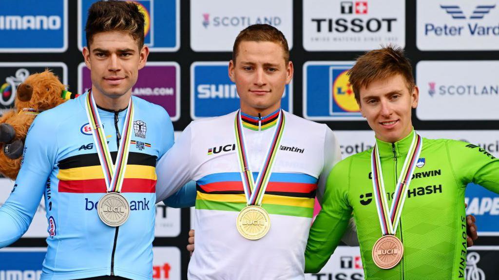 Dutch cyclist Mathieu van der Poel (centre), who won last year's men's road race title, standing next to Tadej Pogacar (right) who is favourite for this year's crown