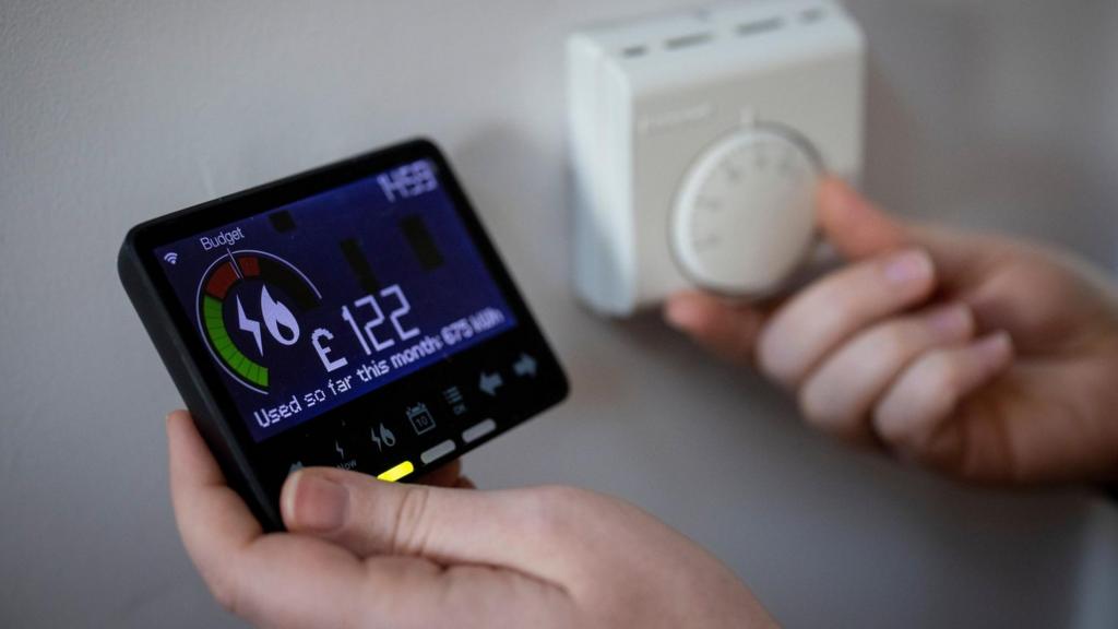 A smart energy meter, used to monitor gas and electricity use and a central heating thermosta