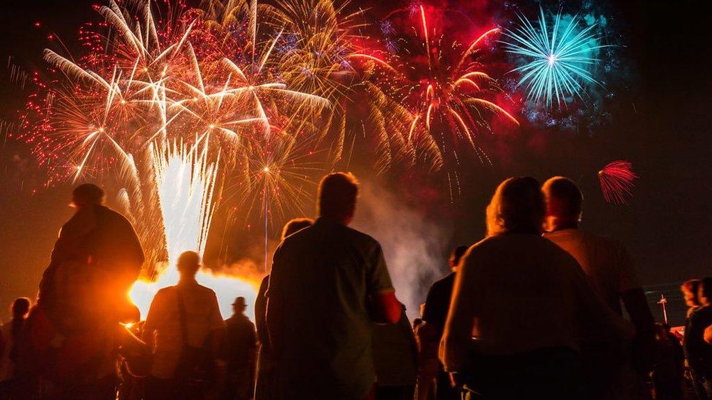 People watch firework display