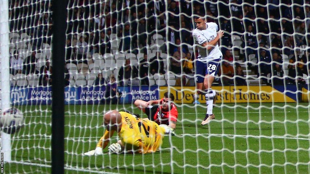 Milutin Osmajic strikes the ball into the net beyond John Ruddy