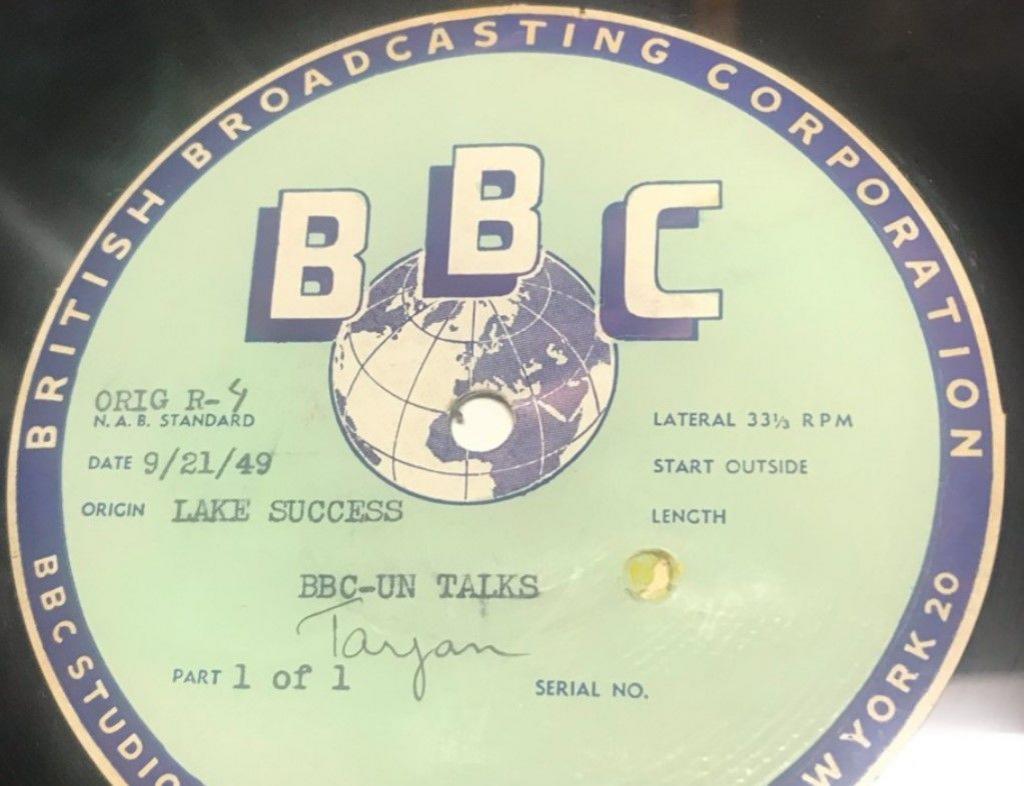 A BBC label, with the letters BBC near the middle by an image of the world. The words British Broadcasting Corporation are around the side of the disc.