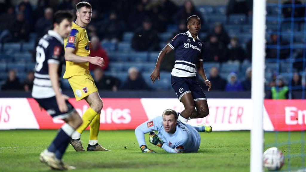 Ra'ees Bangura-Williams scores for Millwall against Dagenham & Redbridge