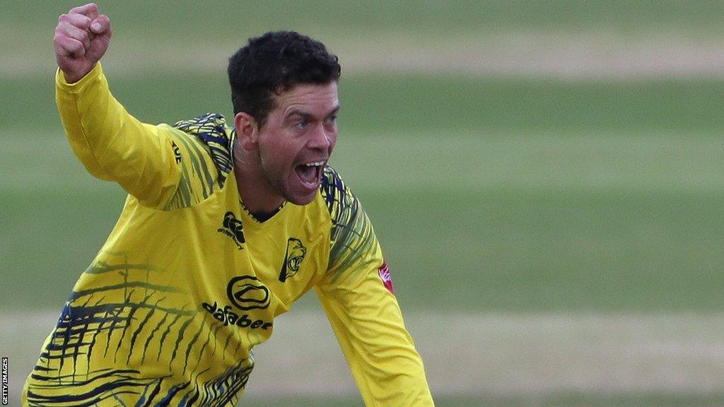 Nathan Sowter celebrates taking a wicket for Durham