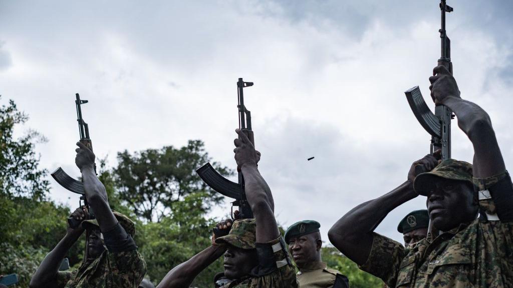 An image of Ugandan soldiers doing a gun salute for Ugandan marathon runner Rebecca Cheptegei during her burial ceremony in Bukwo distric in Uganda - Saturday 14 September 2024.