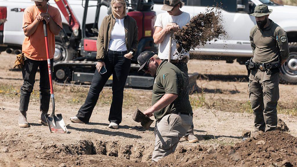 Investigators search for animal remains while executing a second search warrant at Miranda's Rescue as part of an active investigation into alleged animal cruelty, fraud and theft, in Fortuna, California.