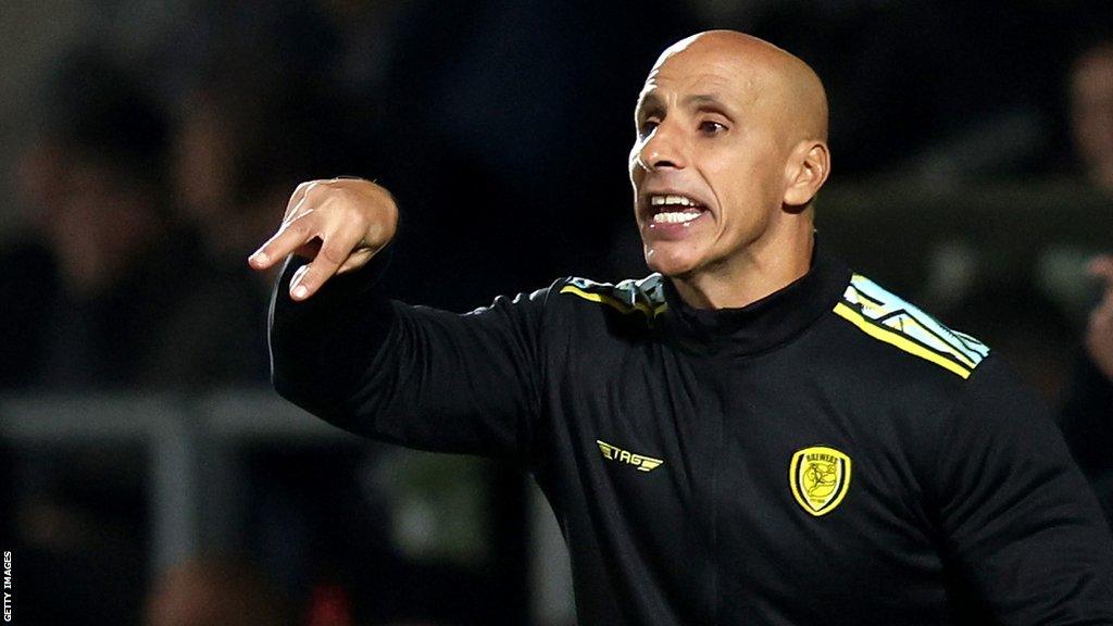 Dino Maamria talks and gestured to his Burton players