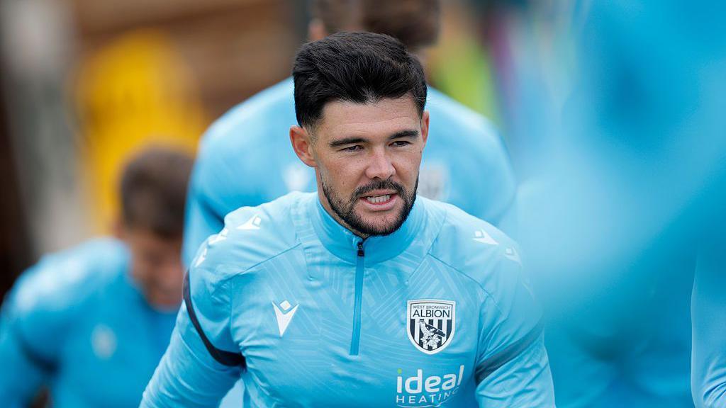 Alex Mowatt in his light blue training kit in action during pre-season warm-ups for West Bromwich Albion