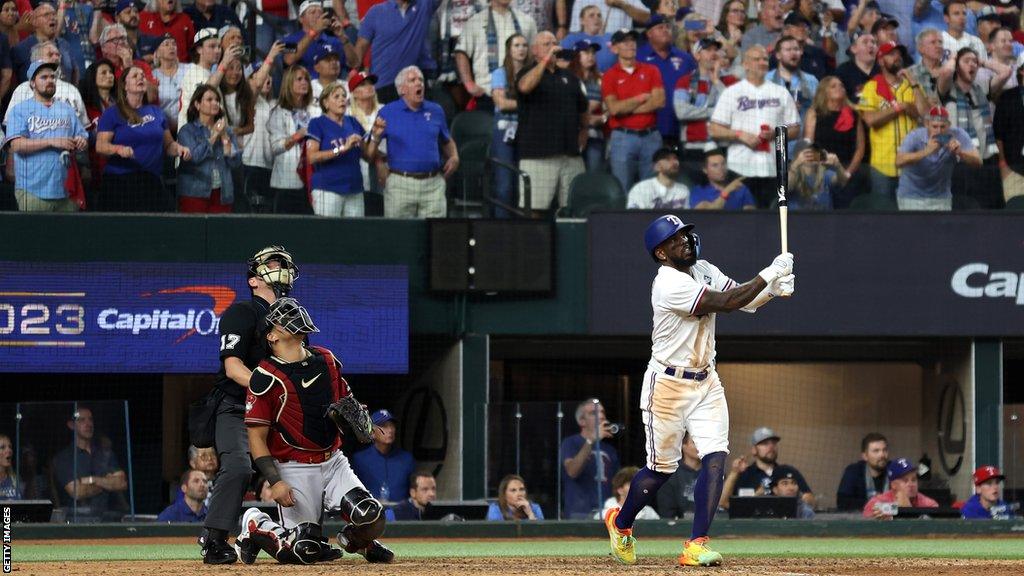 Texas Rangers' Adolis Garcia hits a walk-off home run to win game one of the World Series