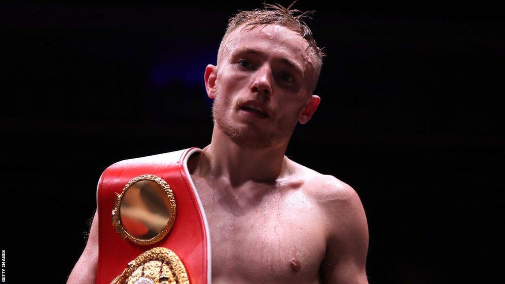 Sunny Edwards with his world title around his shoulder