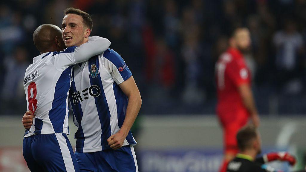 Diogo Jota celebrates scoring Porto's fifth goal against Leicester with team-mate Yacine Brahimi