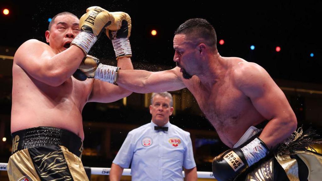 Joseph Parker connects with a consecutive  close    against Zhilei Zhang successful  Saudi Arabia