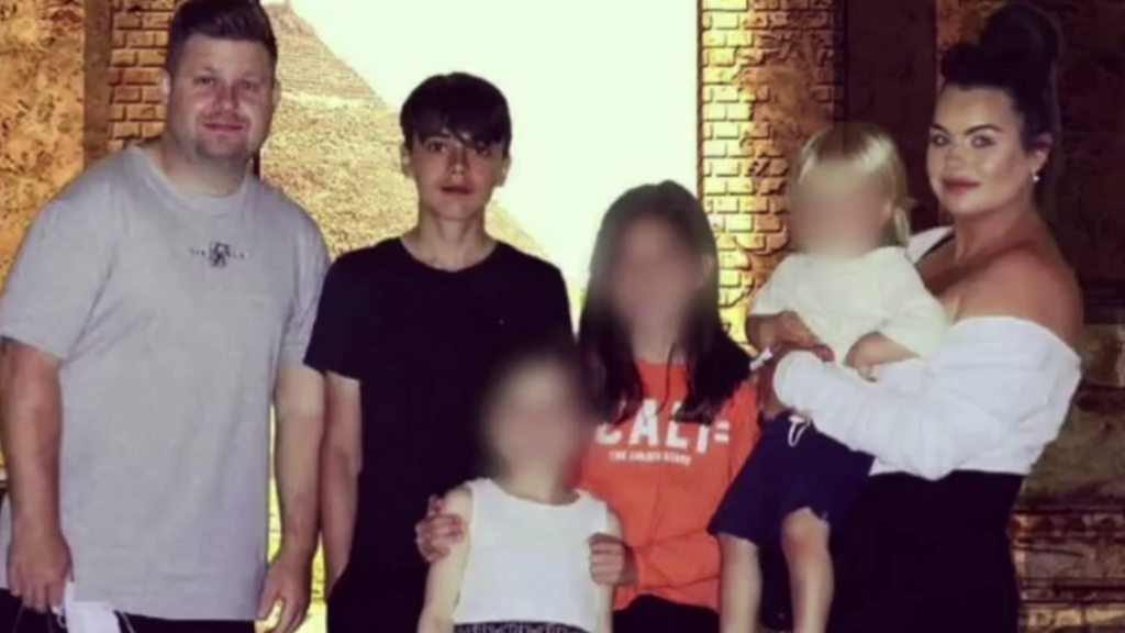 Josh and Chloe Bashford with their four young children all looking to camera.