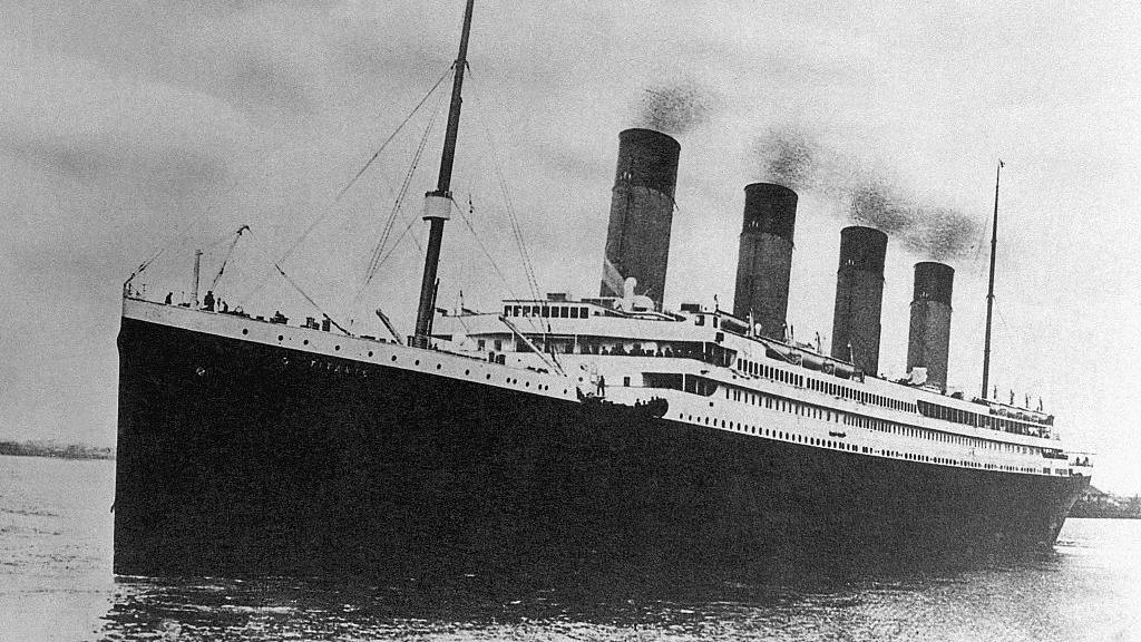 The White Star Line passenger liner R.M.S. Titanic embarking on its ill-fated maiden voyage.