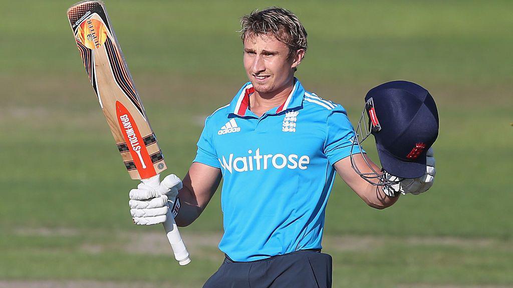 England cricketer James Taylor raises his bat and helmet during play against Sri Lanka in the 2014 Triangular Series