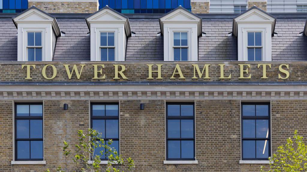 Tower Hamlets sign on Tower Hamlets Town Hall in London.