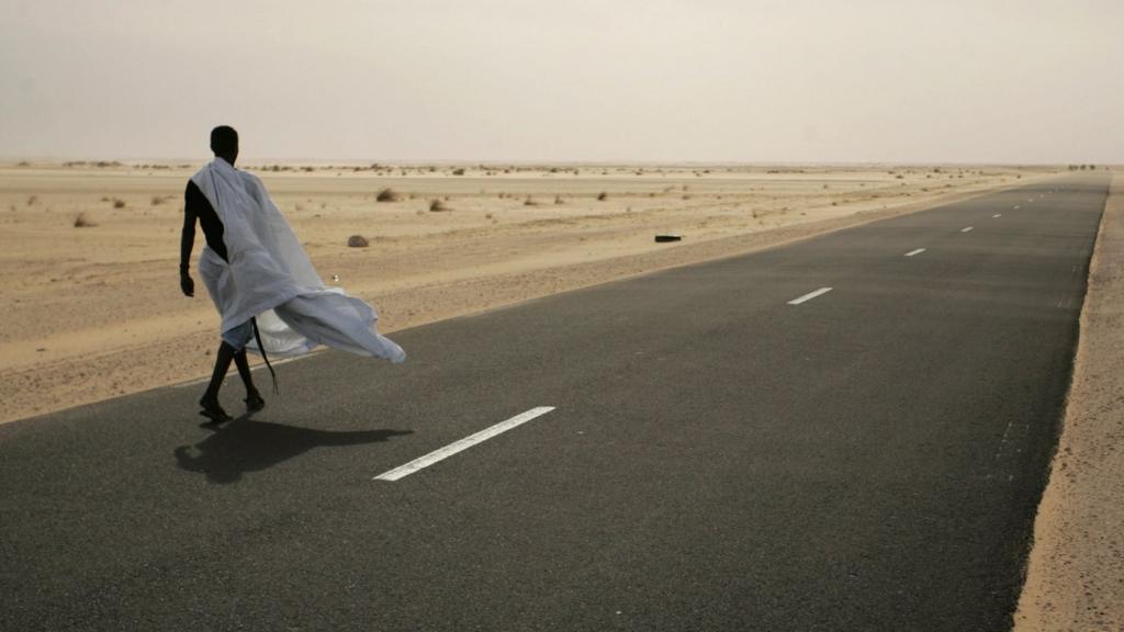 Man walking down road