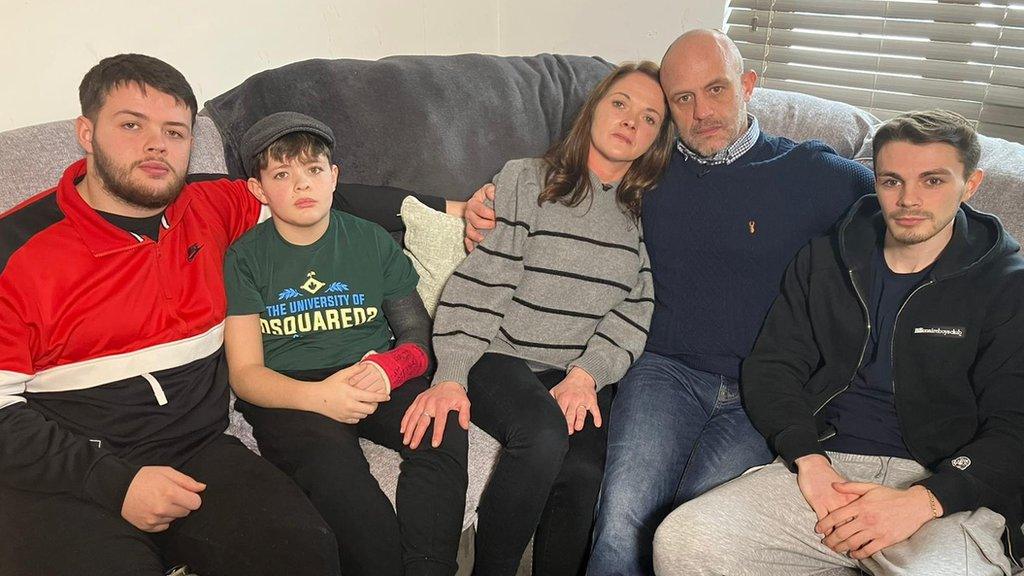 Harry Parker's family sitting on a sofa