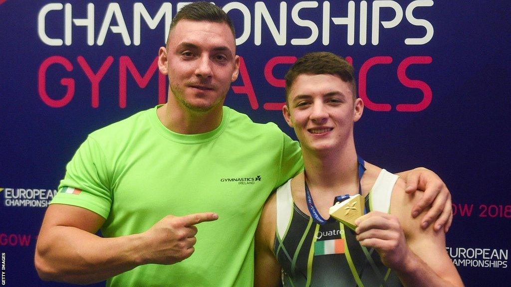 Luke Carson and his coach Rhys McClenaghan after the gymnast's European title triumph in 2018