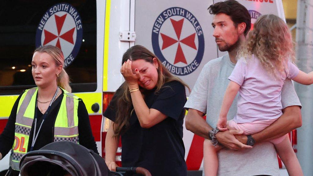 Family in front of ambulance