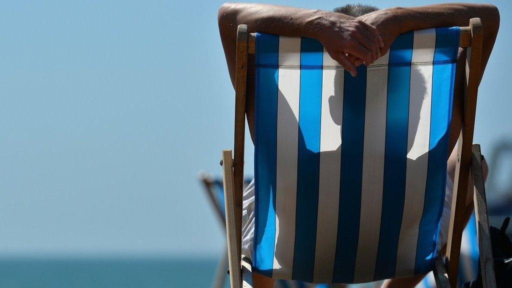 Man-sunbathing-on-deck-chair