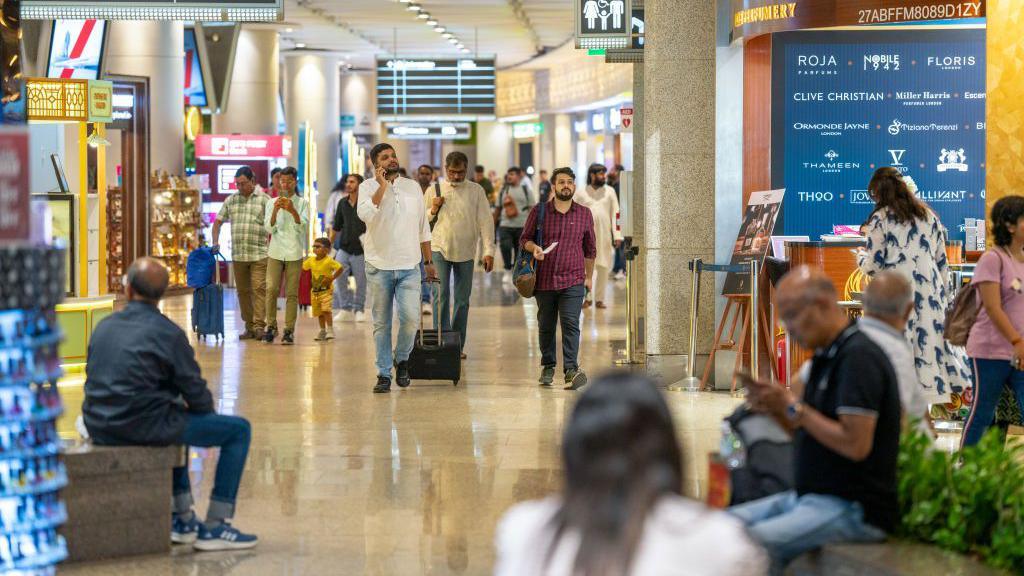 Passengers in the departure area of Chhatrapati Shivaji Maharaj International Airport, operated by Adani Group, in Mumbai, India, on Wednesday, May 22, 2024.