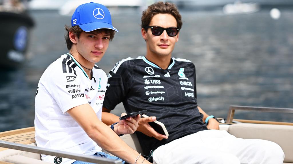 Kimi Antonelli and George Russell arrive for first practice in Monaco on a boat