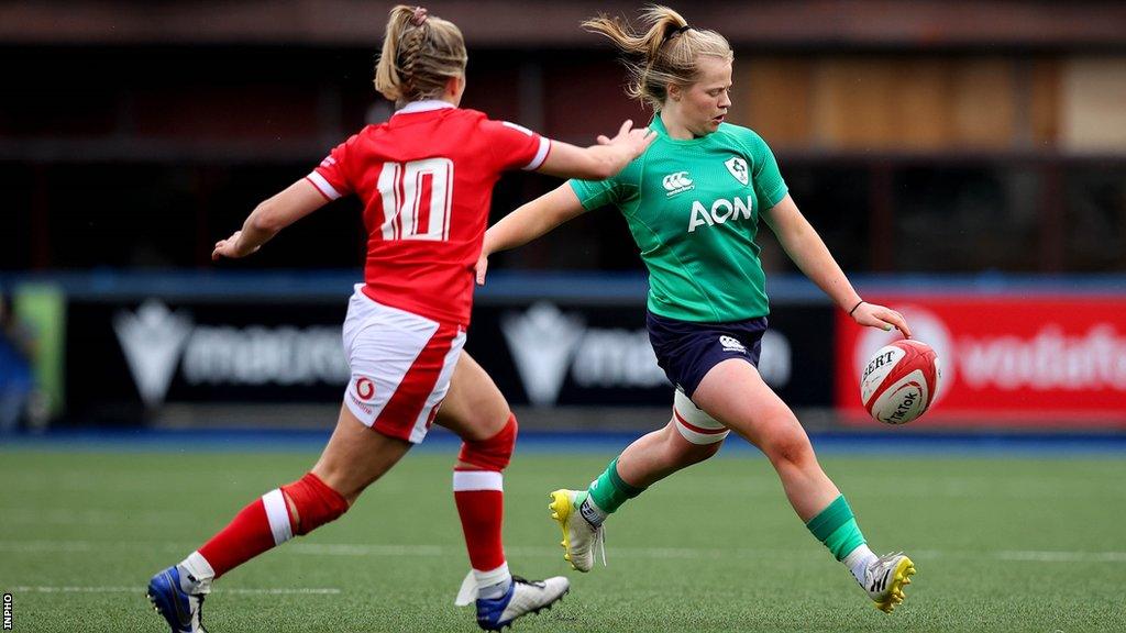 Dannah O'Brien (right) attempts to make a clearing kick after coming on as a replacement in last weekend's heavy defeat by Wales