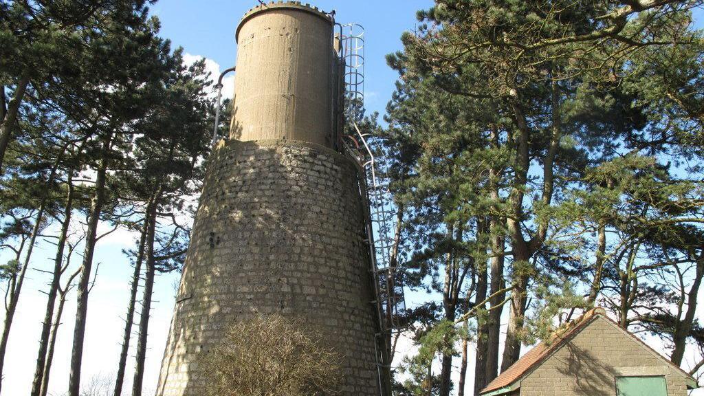 An image of Askham Richard Water Tower in York with trees around