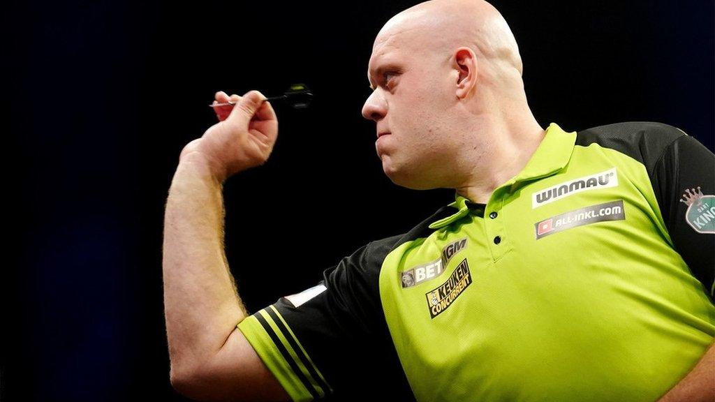 Michael van Gerwen throws a dart